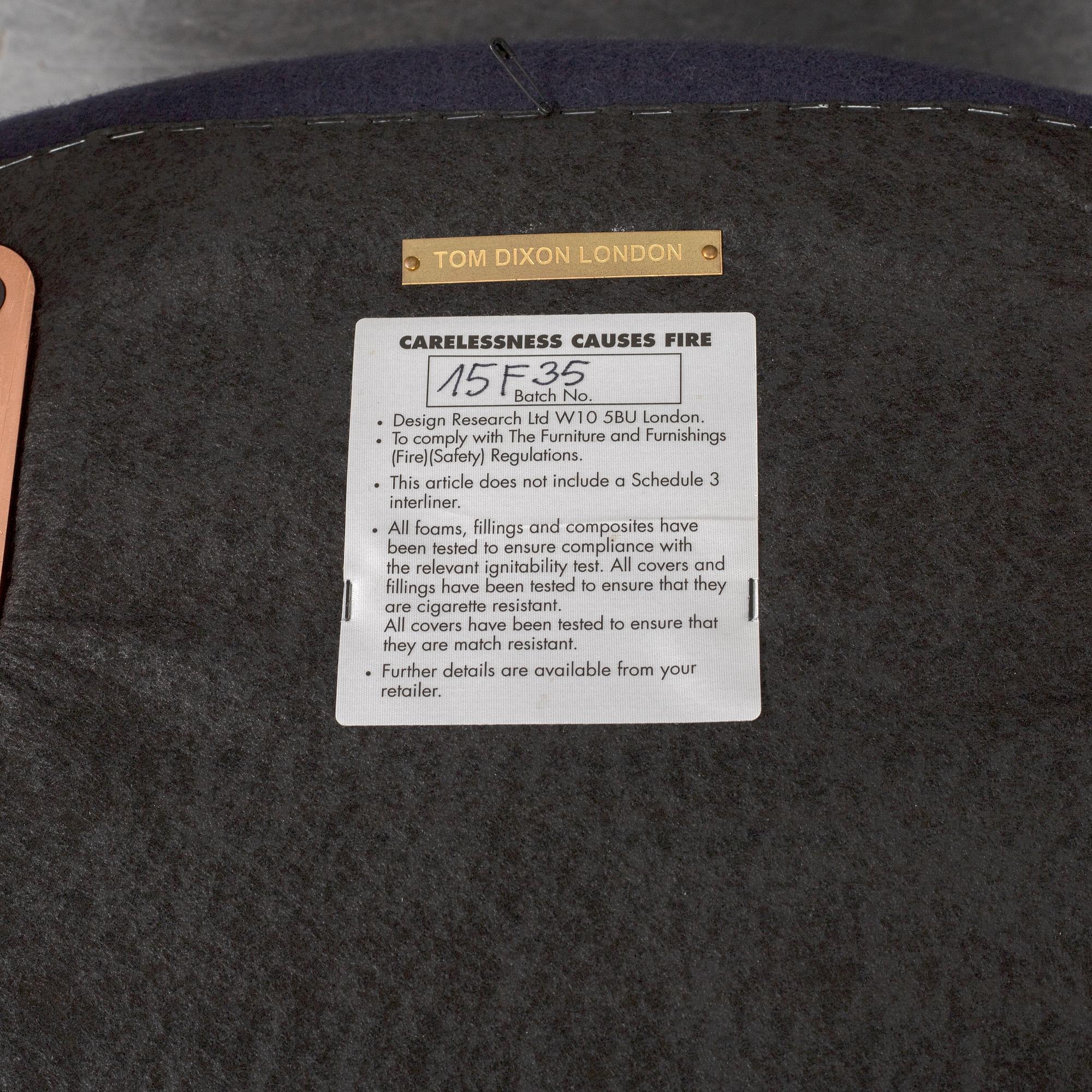 A Tom Dixon "Wingback Dining Chair" from Tom Dixon.