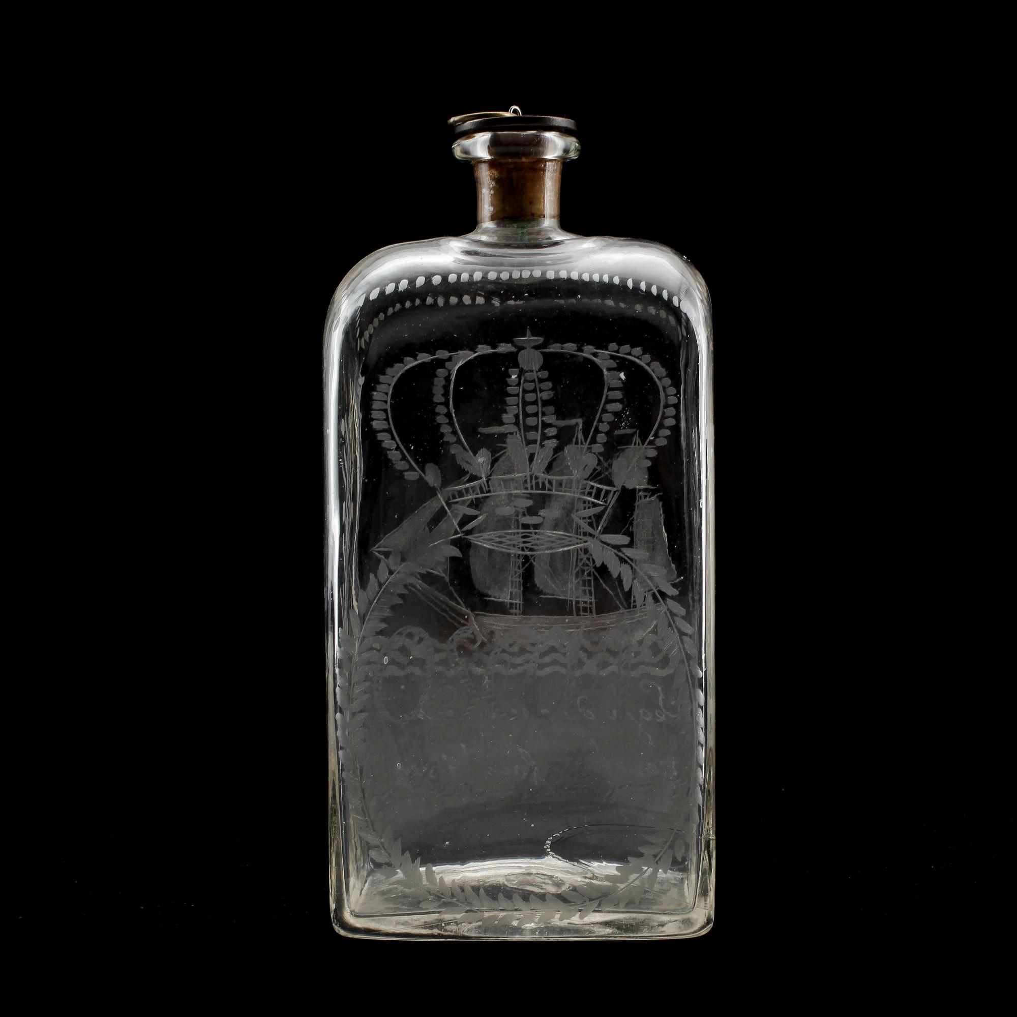 BRÄNNVINSFLASKA, glas, propp med mynt, 1800-tal.