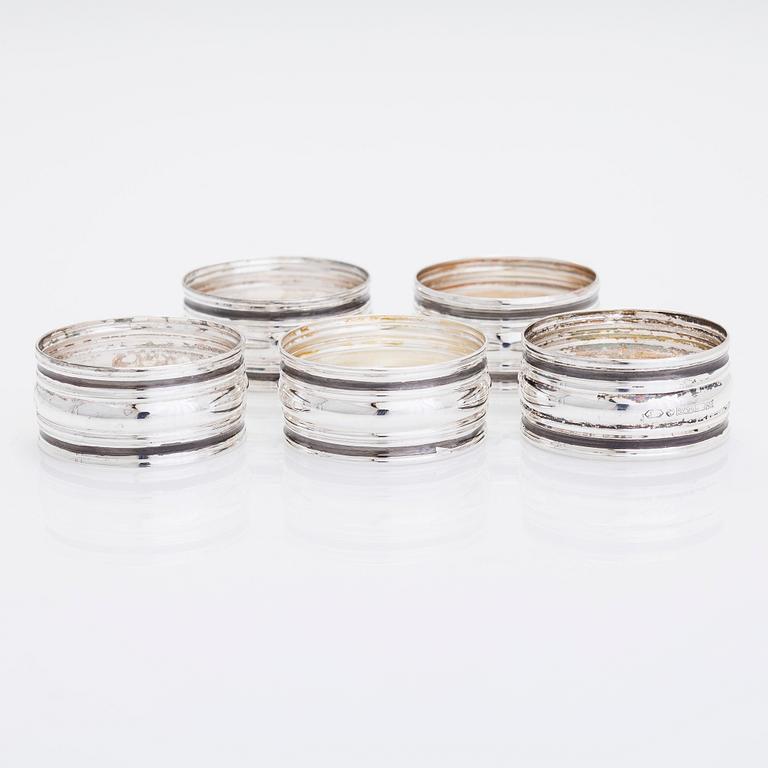 A set of six vodka cups, five napkin rings, a champagne whisk, and a tong, silver, Turku and Hämeenlinna, 1938, 1970.