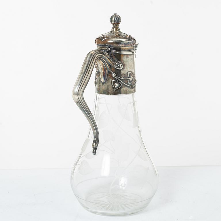 A silver and glass Art Nouveau claret jug, David Andersen, Stockholm, 1901.