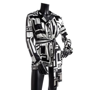 EMILIO PUCCI, a silk shirt with belt.