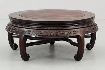 A round hardwood table, Qing dynasty.