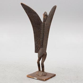 A sculpture, likely Ivory Coast, 20th century.