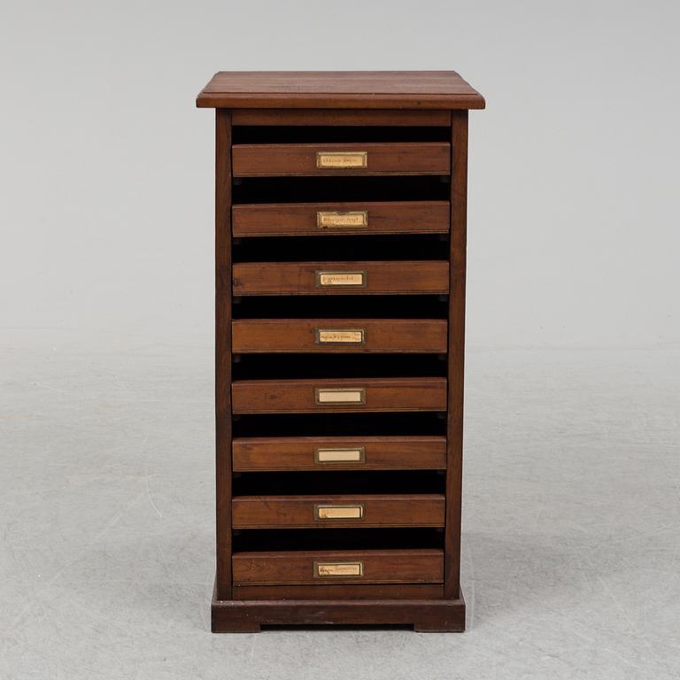 An early 20th Century stained pine office furniture.