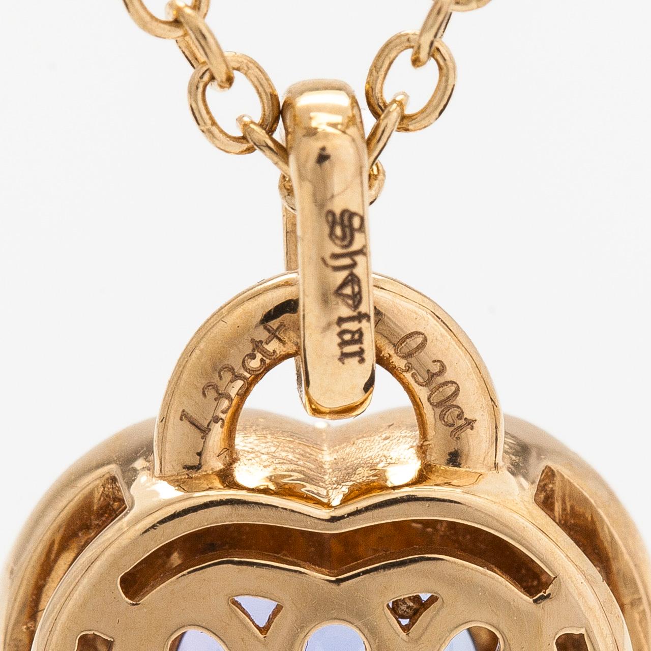 An 18K gold necklace, with a heart-shaped tanzanite and brilliant-cut diamonds.