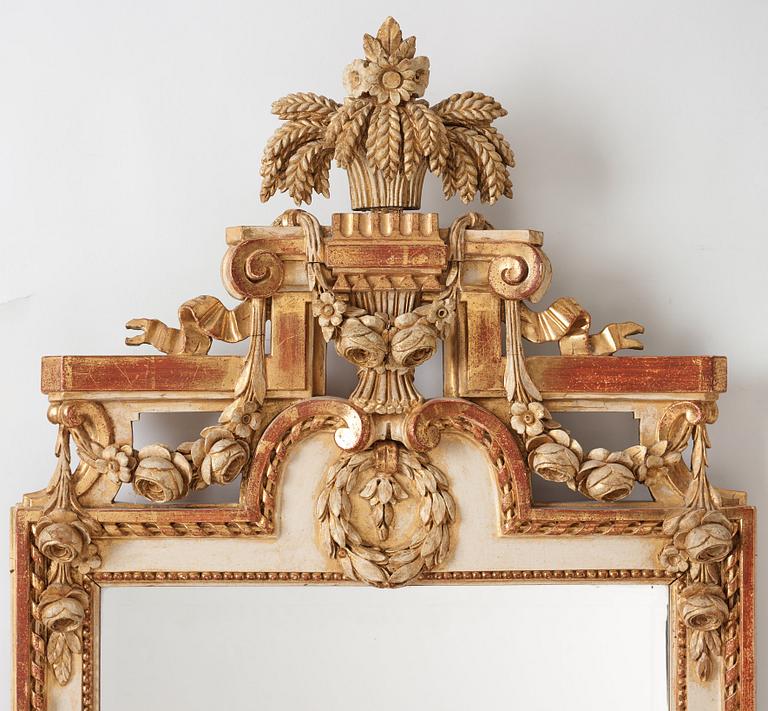 A Gustavian late 18th century two-light girandole mirror.