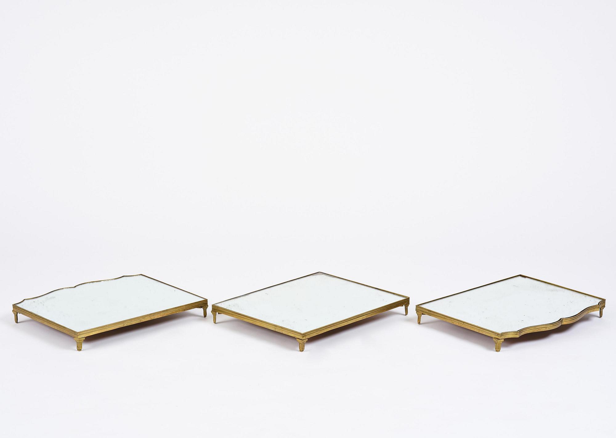 A Gustavian three-piece brass and glass surtout de table, Stockholm, later part 18th century.