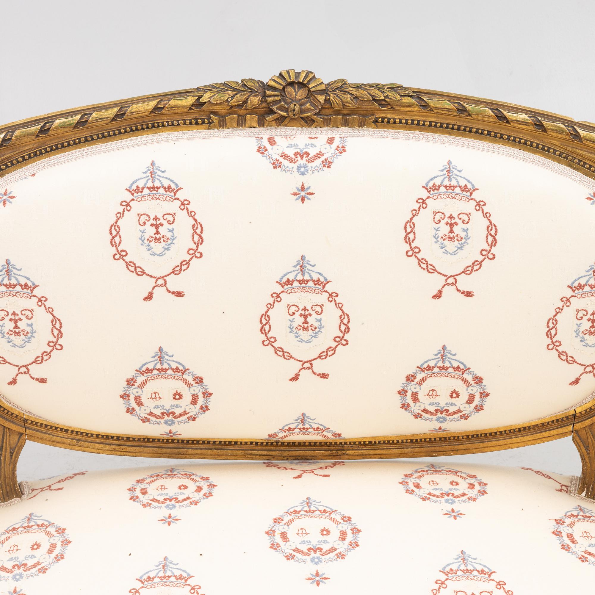 A Gustavian style sofa with two armchairs and two chairs, 20th century.