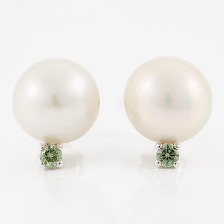 A pair of 18K gold earrings with cultured South Sea pearls.