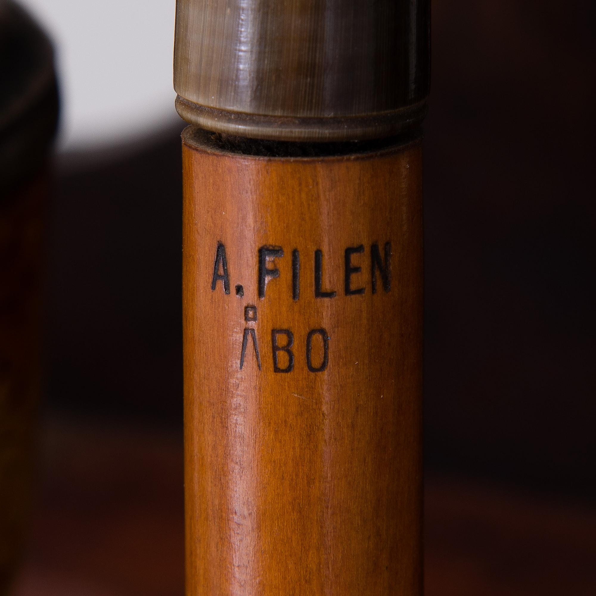 19th century pipes on a wooden pipe rack.