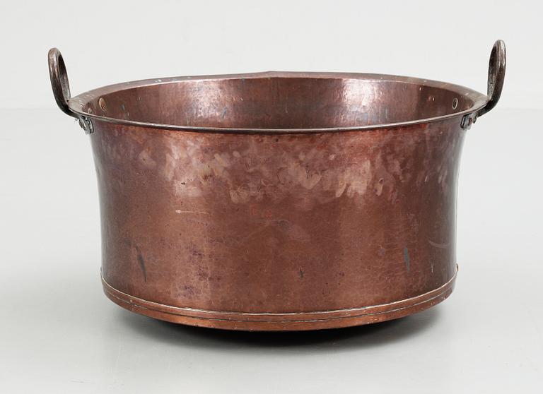 A late 19th century copper cauldron.