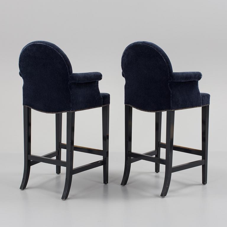 A pair of "The Simplified Moonback Counter Height Stool" barstools by Soane Britain.