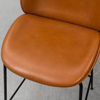 GAMFRATESI, a pair of 'Beetle Bar' leather chairs from GUBI.