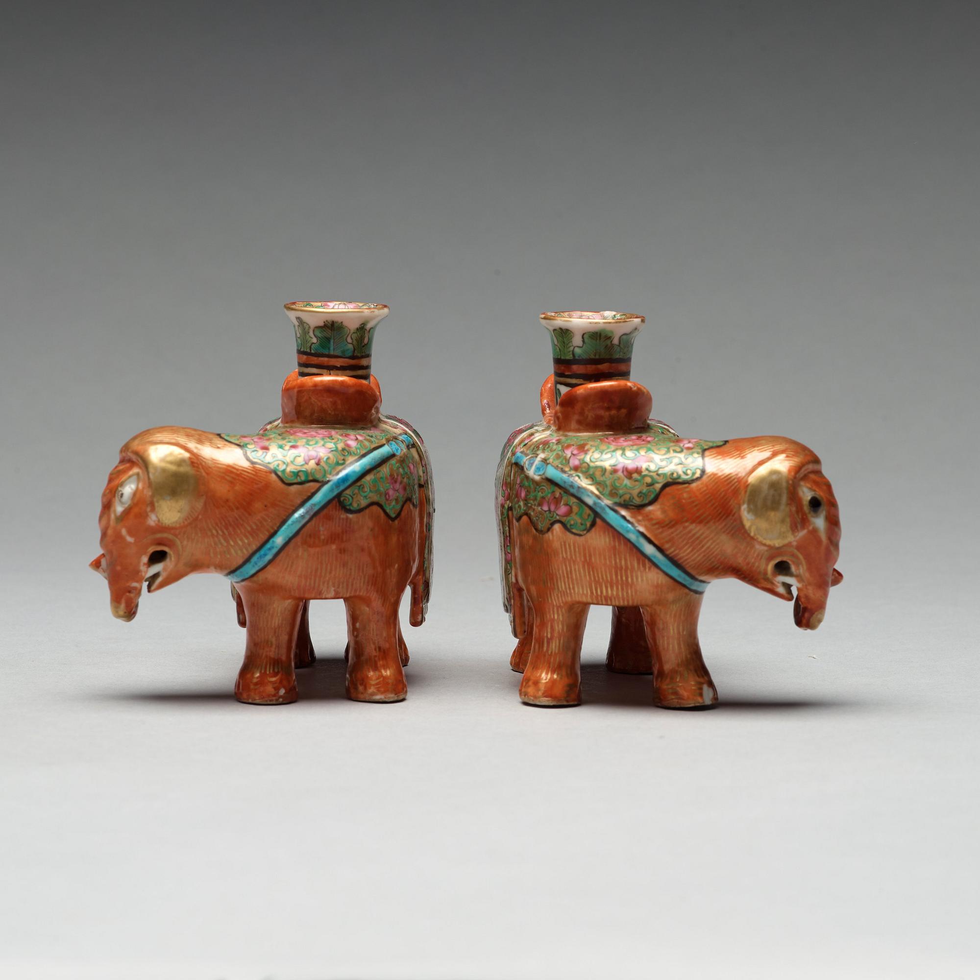 A pair of Canton candle sticks in the shape of elephants, Qing dynasty, 19th century.