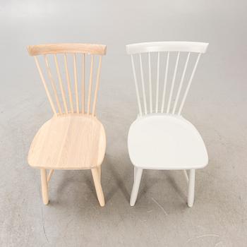 A set of two Carl Malmsten "Lilla Åland" chairs from Stolab, contemporary.