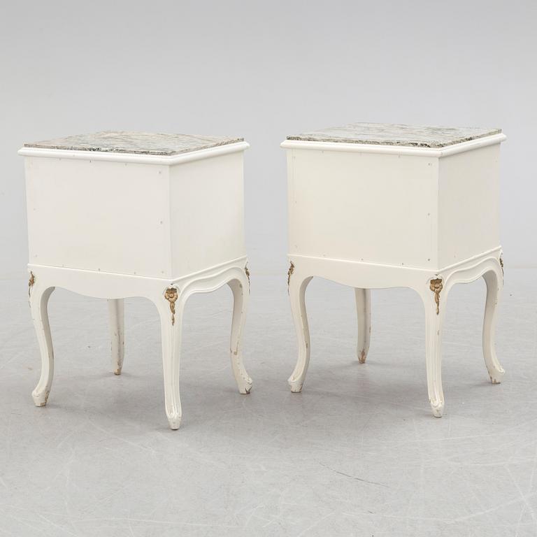 A pair of early 20th century rococo style bedside tables with marble top.