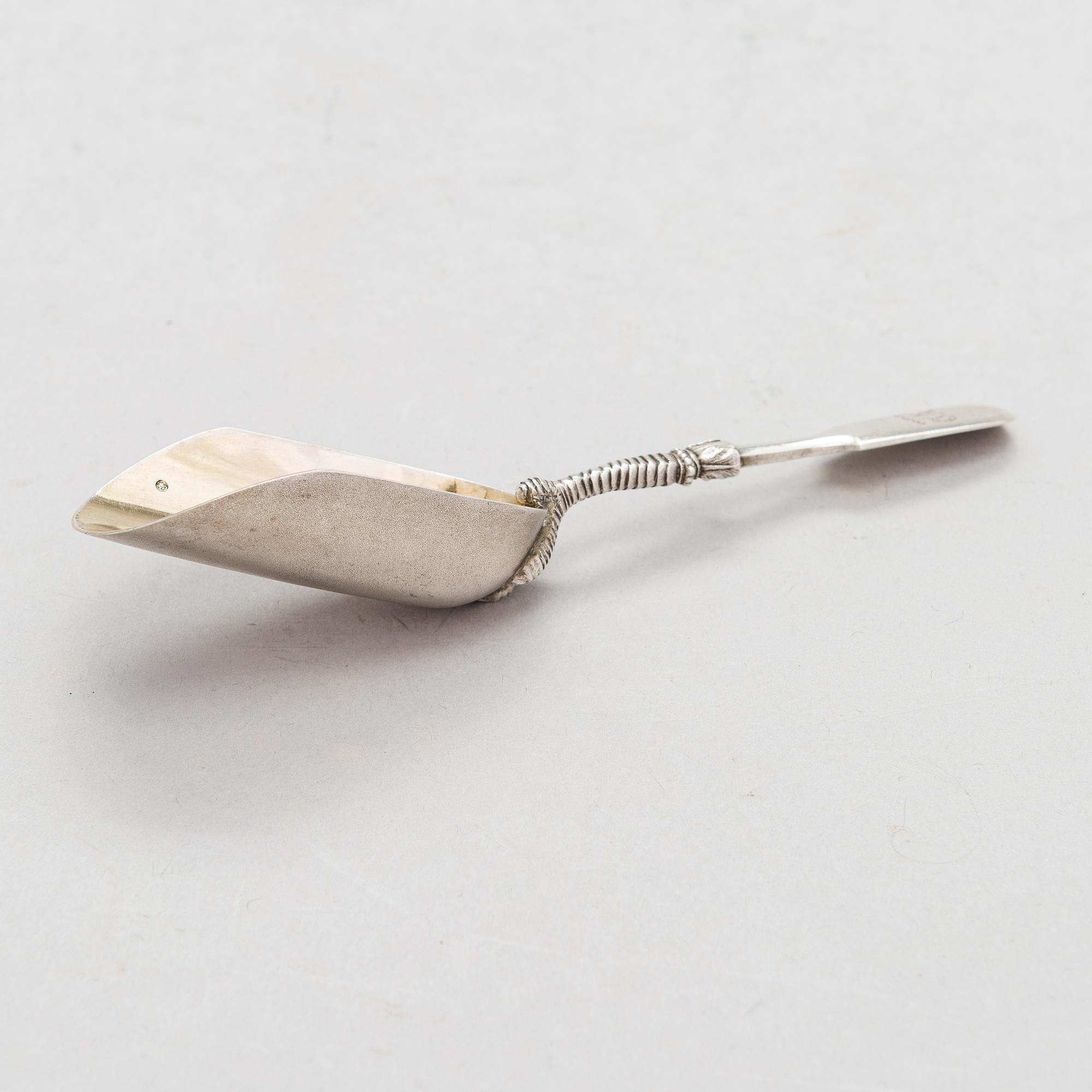 A Russian silver, parcel-gilt tea caddy spoon, Moscow from around the turn of teh century/ early 20th century.