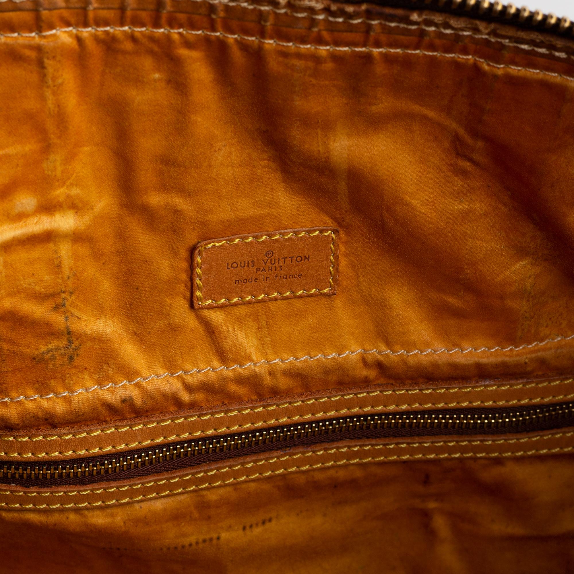 Louis Vuitton, a monogram canvas weekend bag.