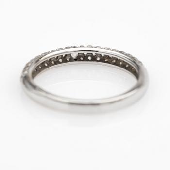 Ring, 14k white gold with brilliant-cut diamond and white stones.