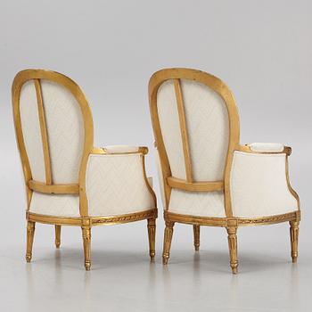 A near pair of French Louis XVI giltwood bergères, Paris, late 18th century.