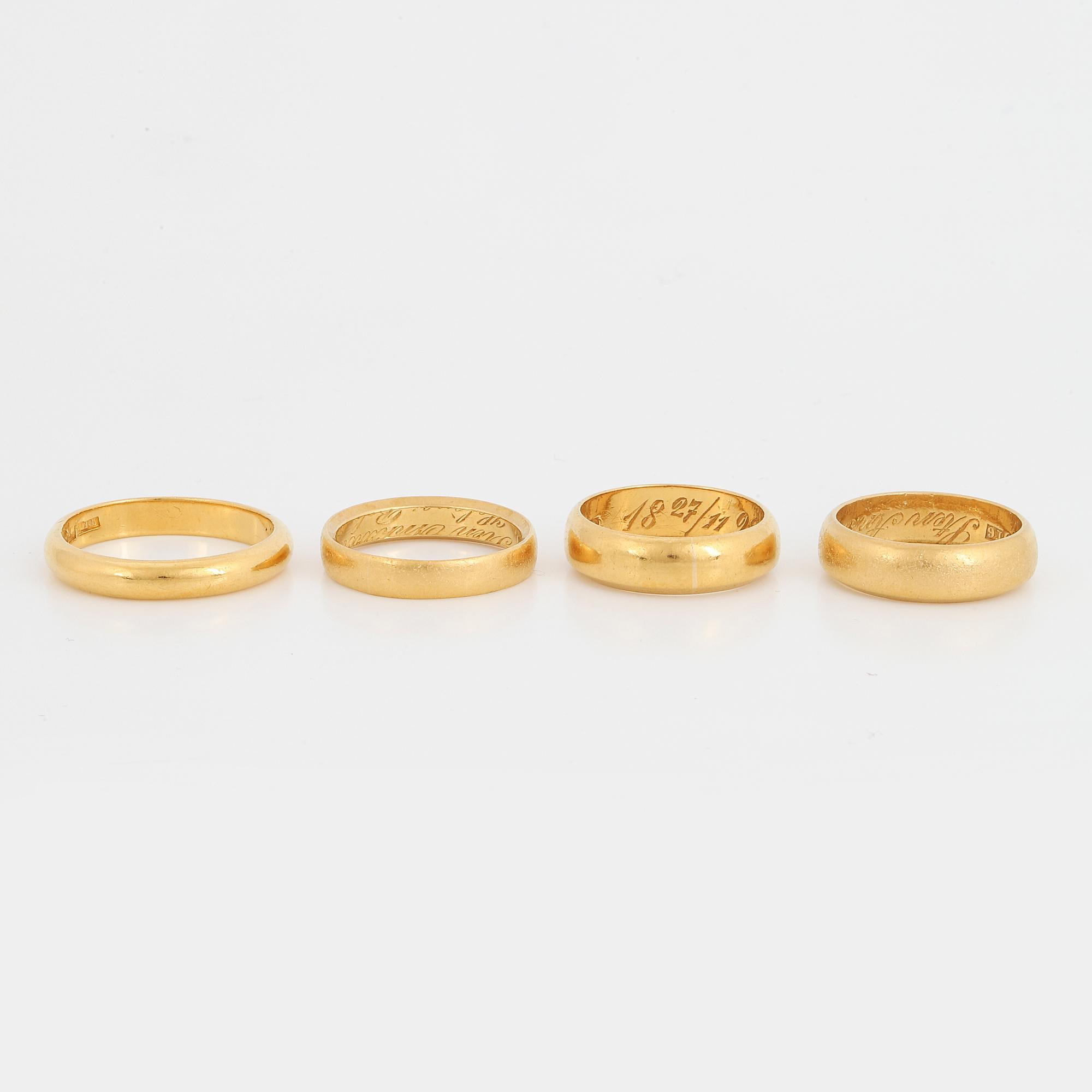 Four 23K gold rings.