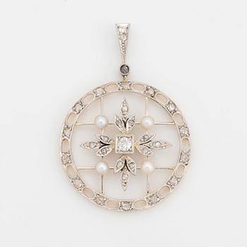 A platinum and gold pendant set with old- and rose-cut diamonds and pearls.