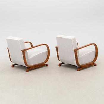 A pair of Art Deco armchairs.