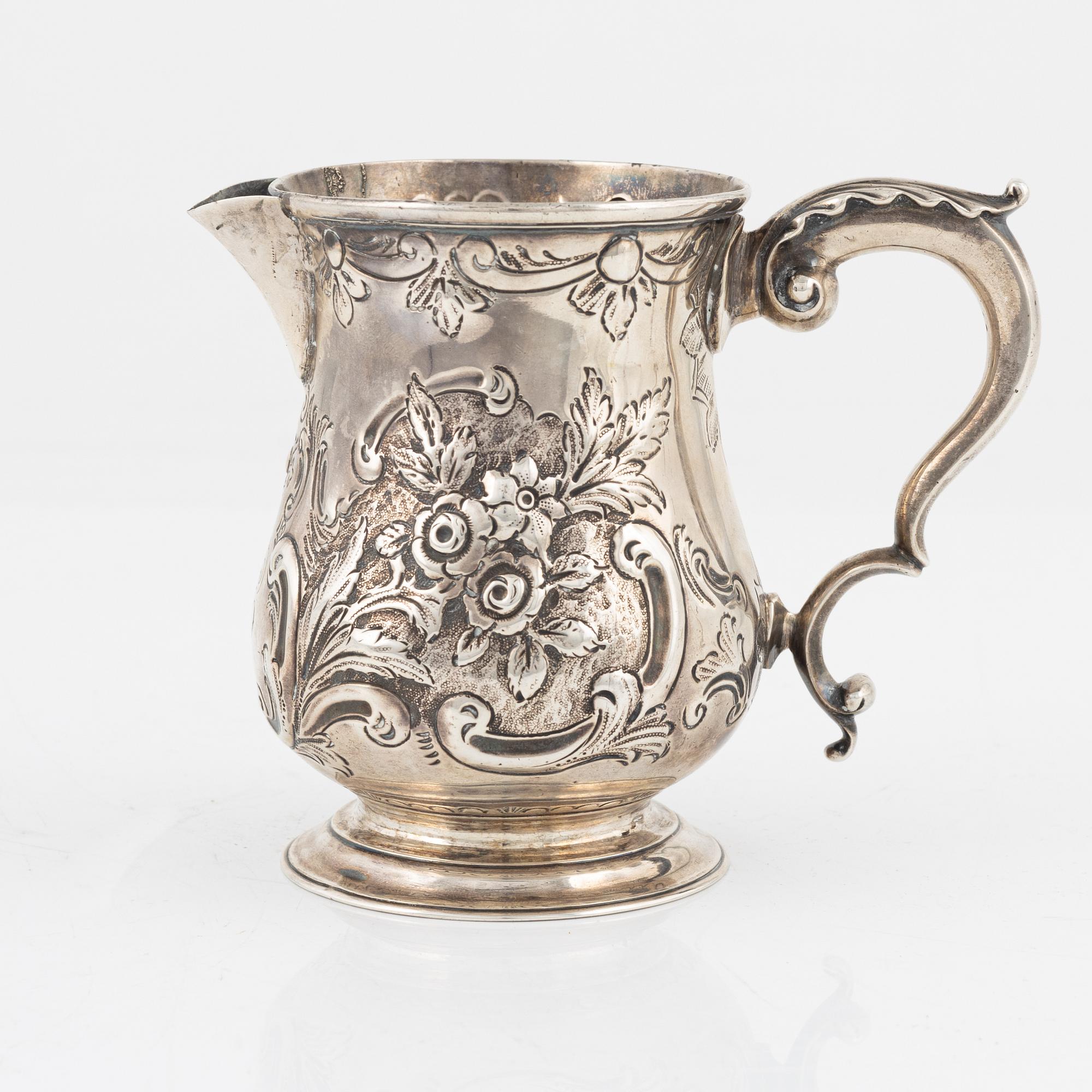 An English silver creamer, London, 1887.