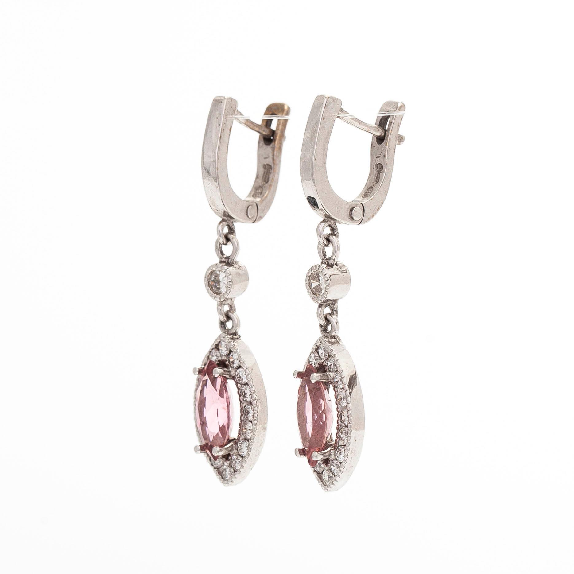A pair of 14K white gold earrings, set with brilliant-cut diamonds and pink tourmalines.