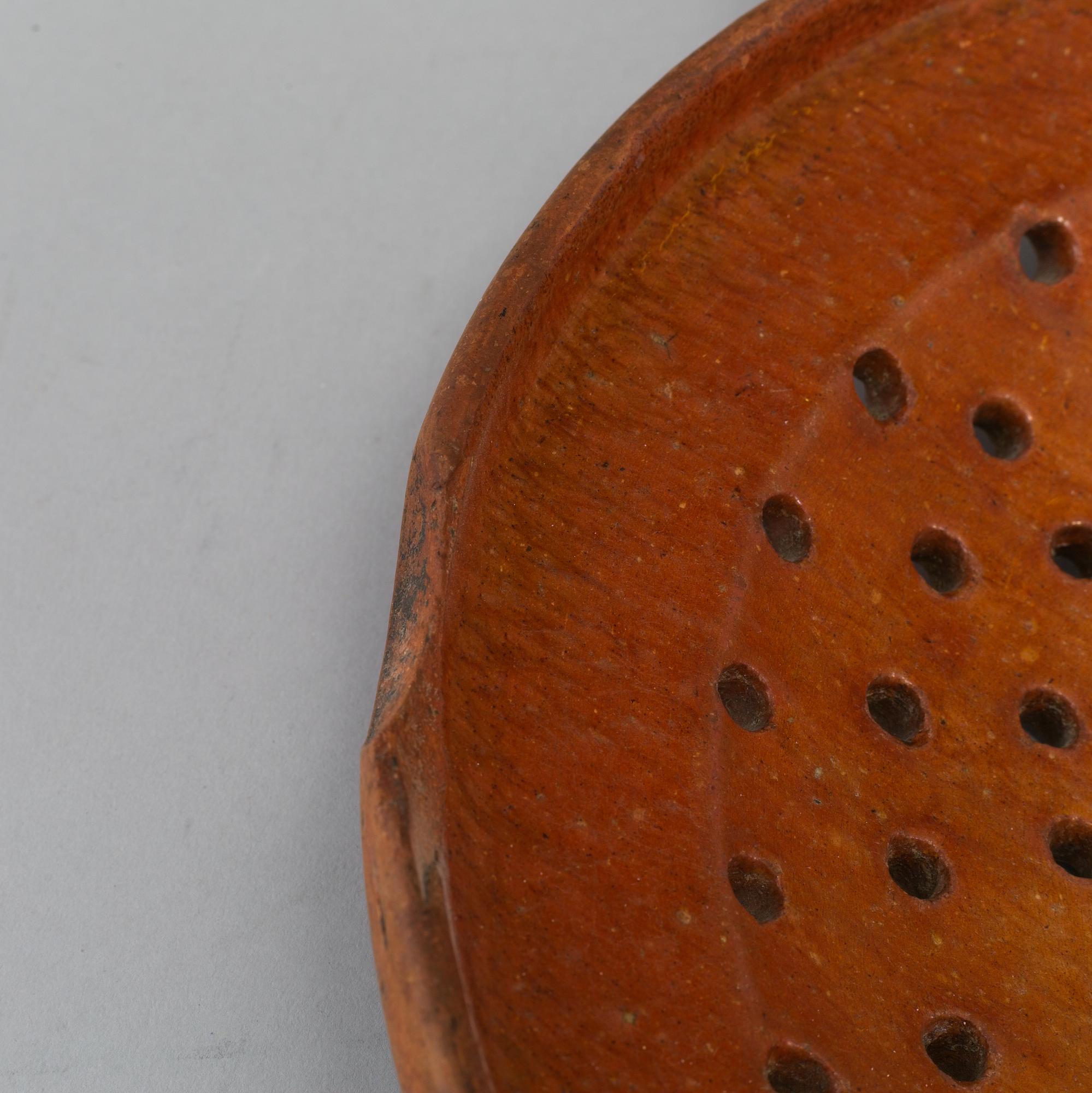 Two pottery strainers, 19th Century, Sweden.