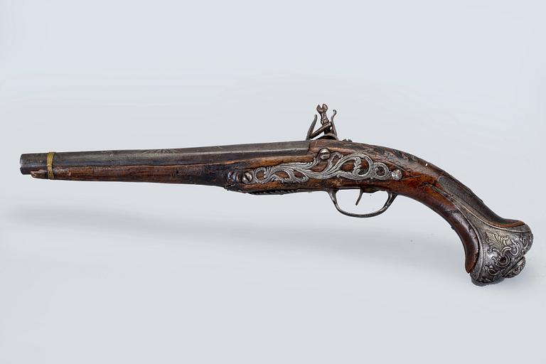 An 18th Century flinlock pistol.