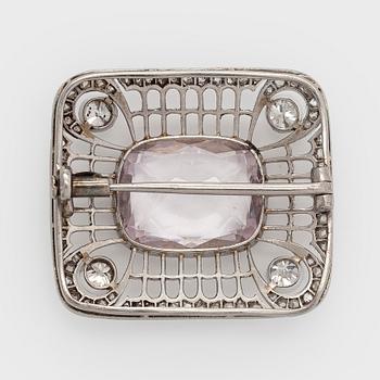 A platinum brooch with morganite and old cut diamonds.