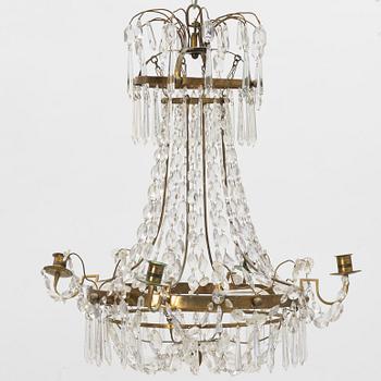 A late Gustavian four-branch brass and cut glass chandelier, circa 1800.