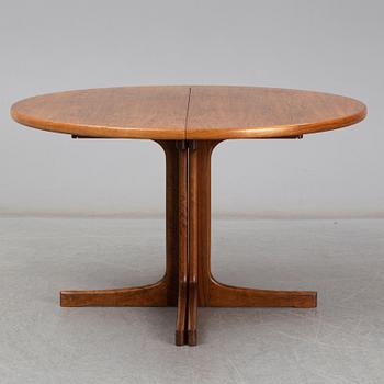 A walnut vereered dining table, mid 20th Century.