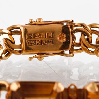 ARMBAND, 18K guld med fasettslipade citriner, NSE, Köping, 1970. Vikt 26,0 gram.