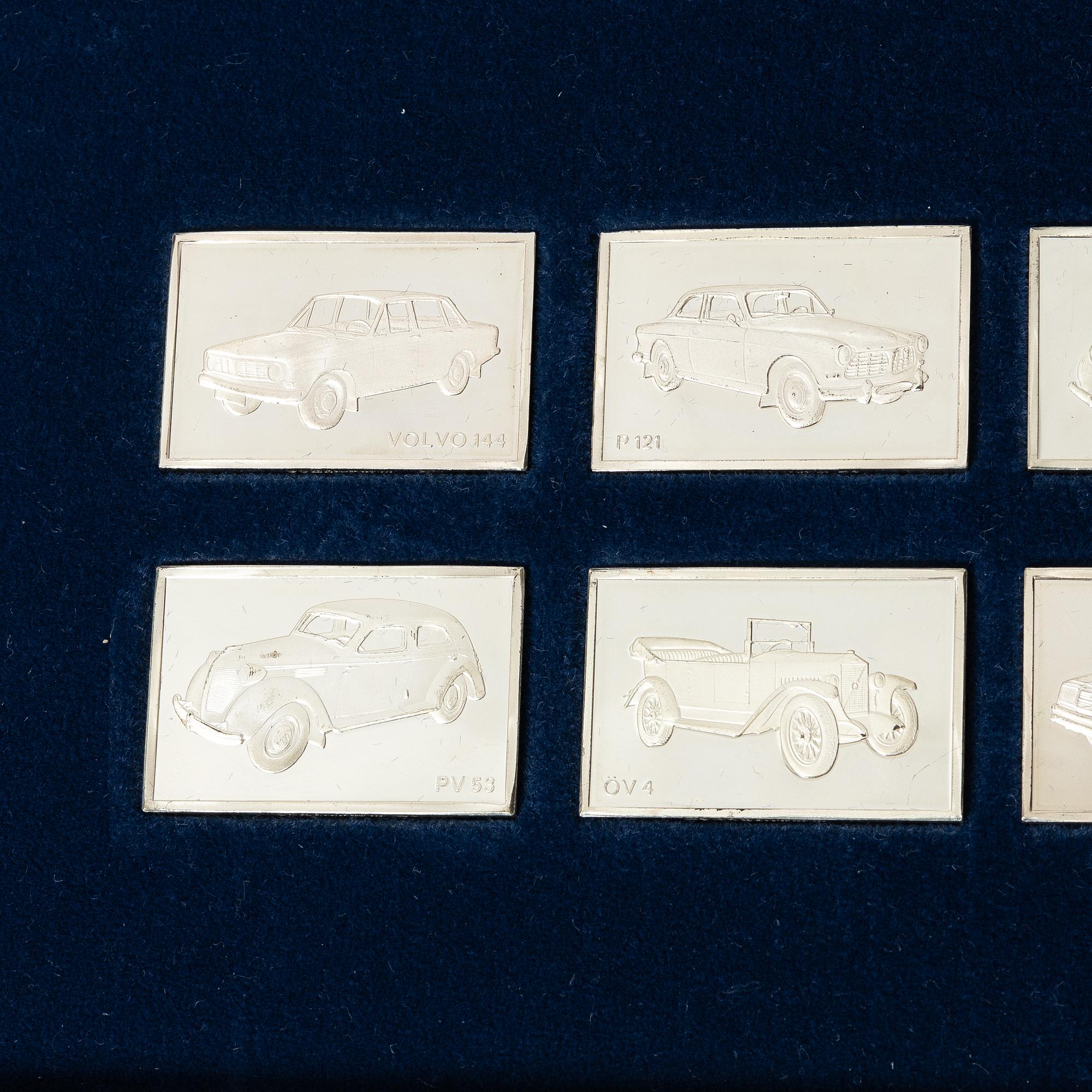 Plaketter, 12 st, silver, "De Historiska Volvobilarna 1927-1977", Franklin Mint.