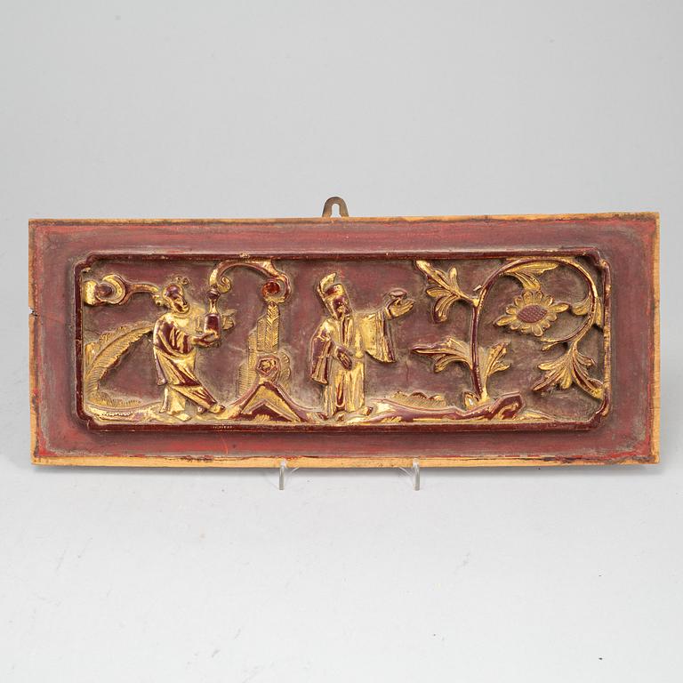 A wooden tray and two panels, Qing dynasty, 19th Century.