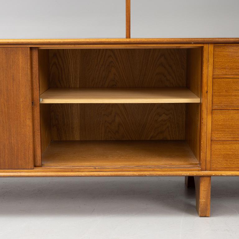 Josef Frank, a mahogny sideboard with cabinets, shelves, writing flap and drawers, Svenskt Tenn, a special commission, 1940-50s.