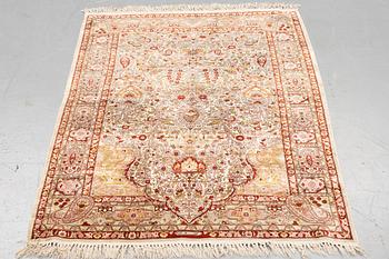 A rug, Old silk Hereke, ca 152 x 110 cm.