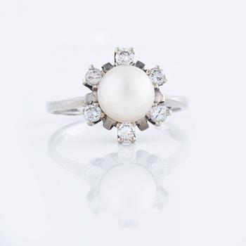 A cultured pearl and brilliant cut diamond ring.