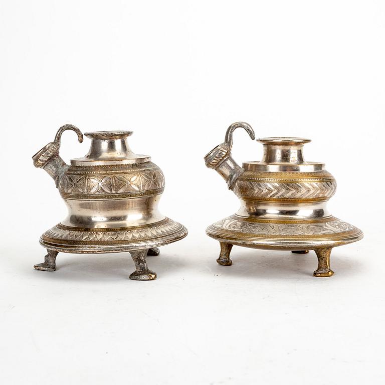 A pair of metall candle holders, India, 20th Century.