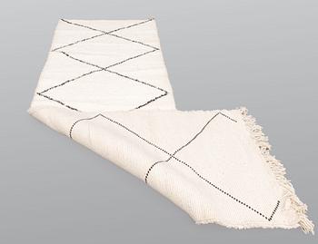 A Moroccan runner carpet, 300 x 88 cm.