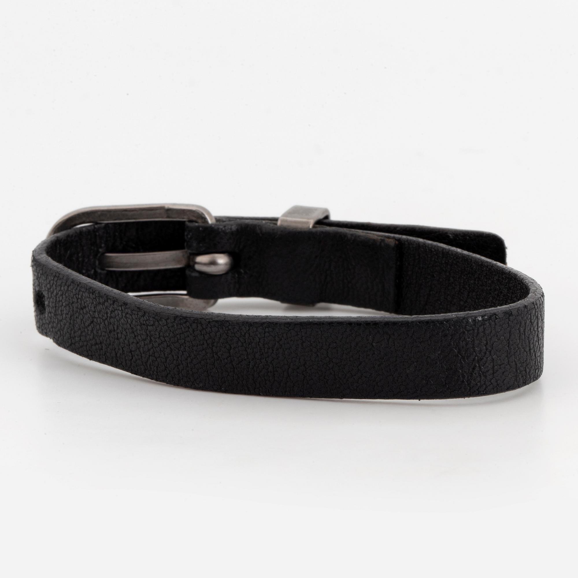 CHANEL, a leather bracelet.