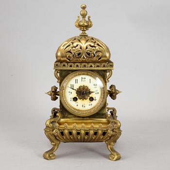 A brass mantle clock, early 20th century.