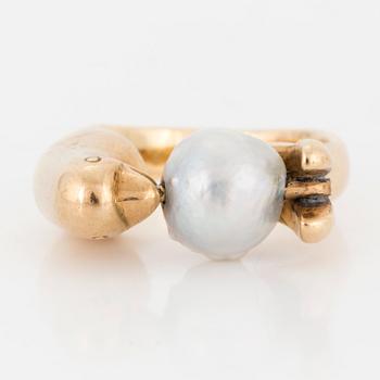 A ring with pearl.