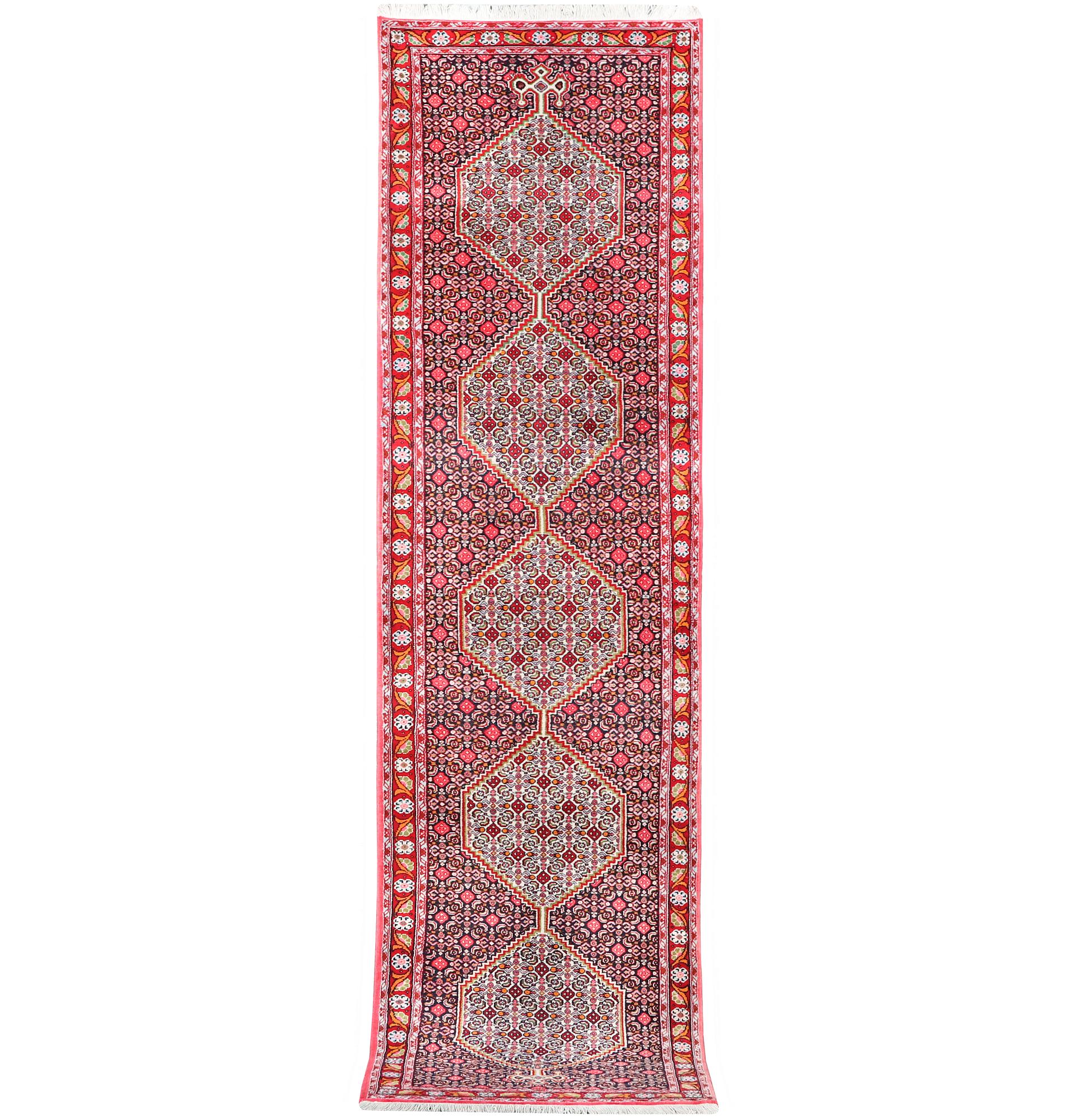 A Runner carpet, Senneh, c. 325 x 80 cm.