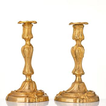 A pair of French 18th century gilt-bronz candlesticks, marked. Louis XV.