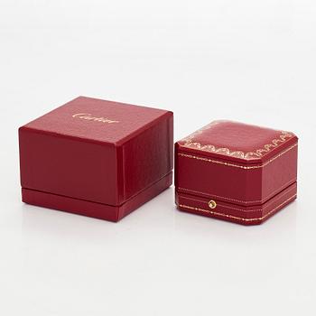 Cartier, an 18K white gold 'Love' ring with three brilliant-cut diamonds.