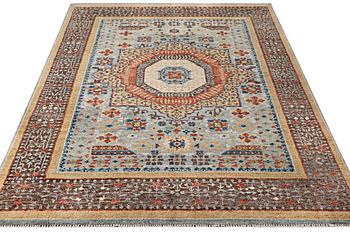An oriental carpet with Mamluk design, c. 356 x 255 cm.