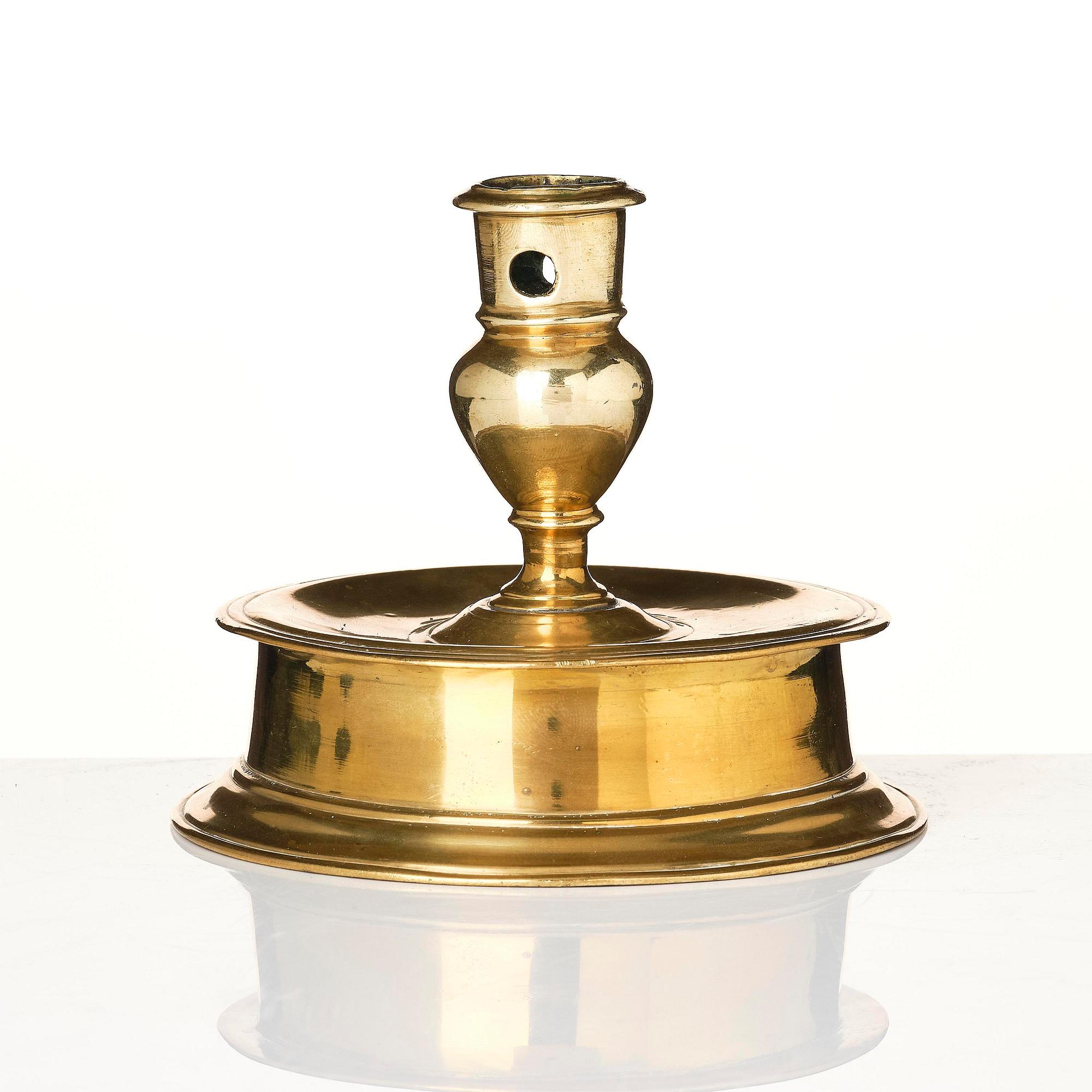 A Northern European baroque brass candlesticsk, late 17th century.